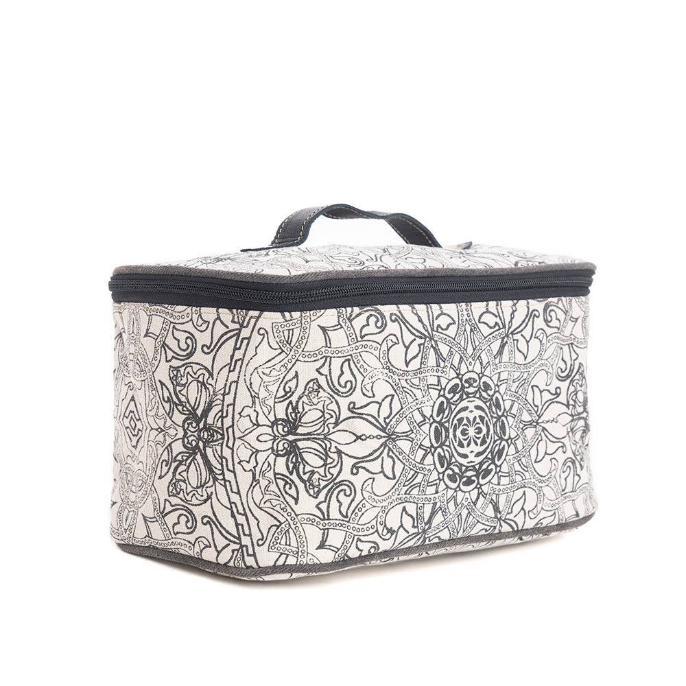 Vintage-inspired black and white toiletries bag with a zippered closure and an ebony leather handle.