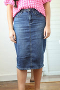 Knee-length medium blue denim skirt featuring a fitted silhouette, zipper and button closure, and front and back pockets.