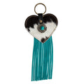 Heart-shaped key fob featuring a hair-on hide texture with turquoise fringe and a decorative center element.