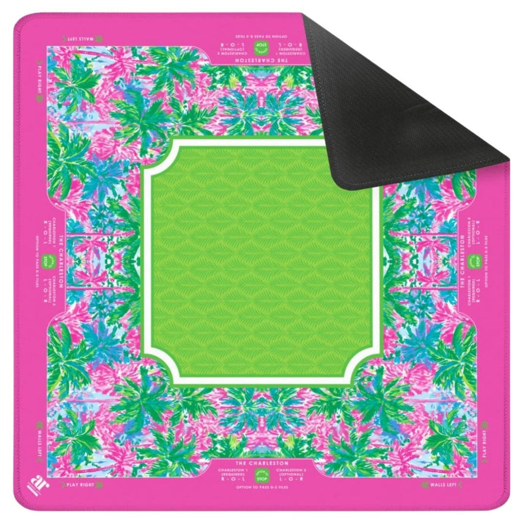Vibrant pink Mahjong mat featuring tropical palm leaf patterns in blue and green, designed for stylish gameplay.