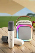 Karaoke Bluetooth speaker set featuring two microphones and colorful LED lights, perfect for fun gatherings.