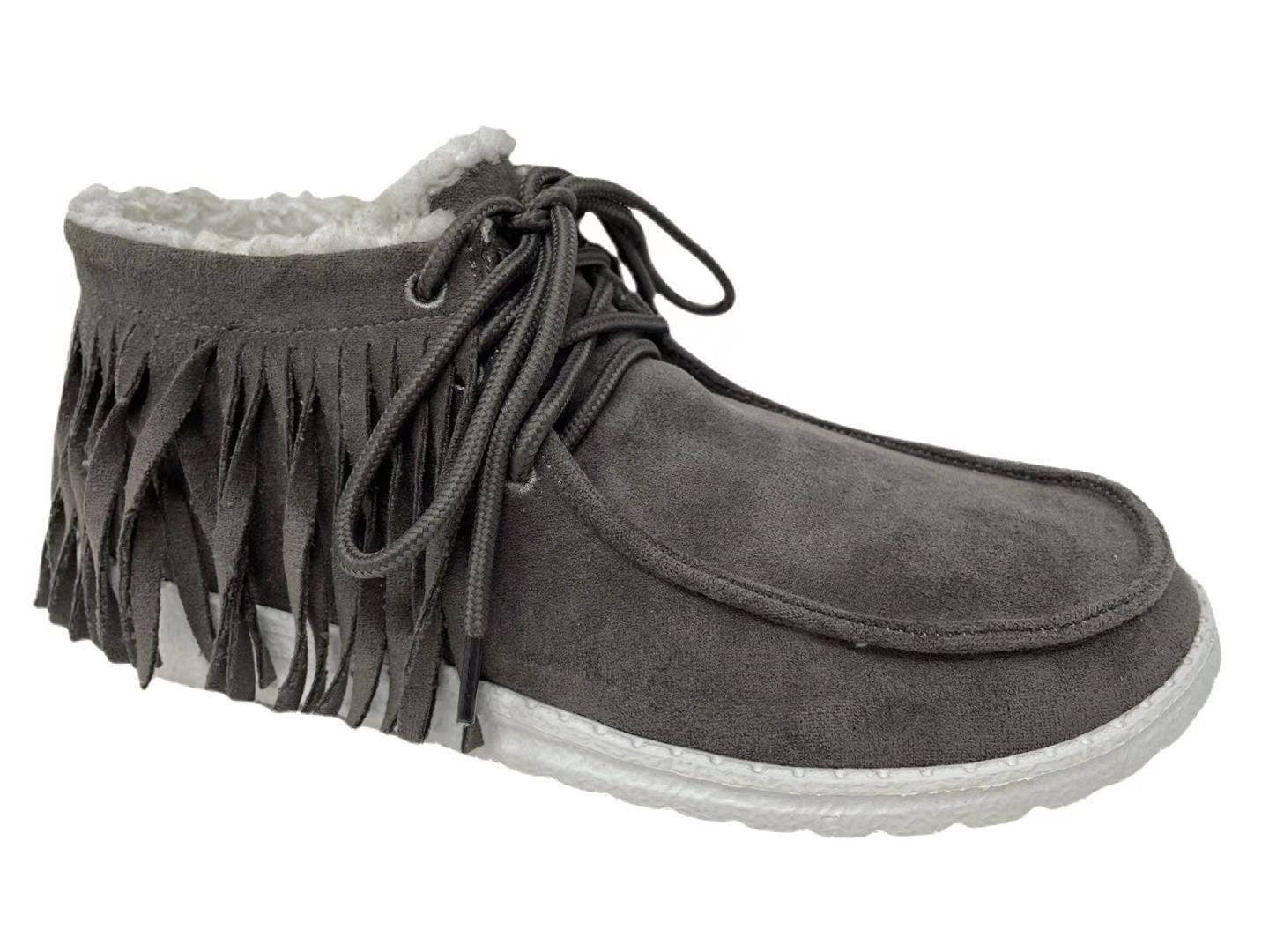 Taupe shoe with fringe detailing, lace-up closure, and a comfortable low profile design for a casual boho look.