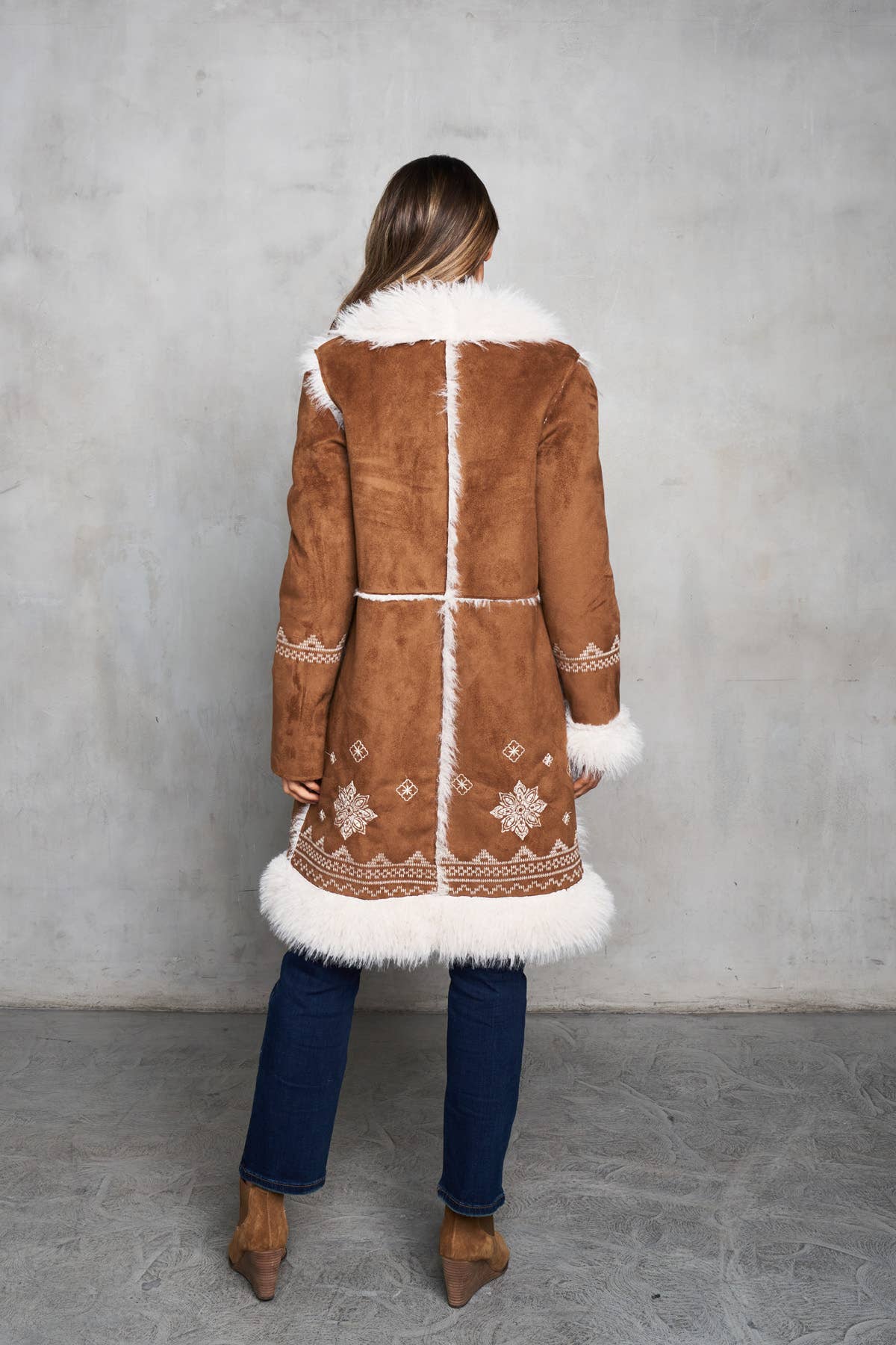 Faux suede camel coat with shearling trim, featuring delicate embroidery on the collar, cuffs, and sleeves.