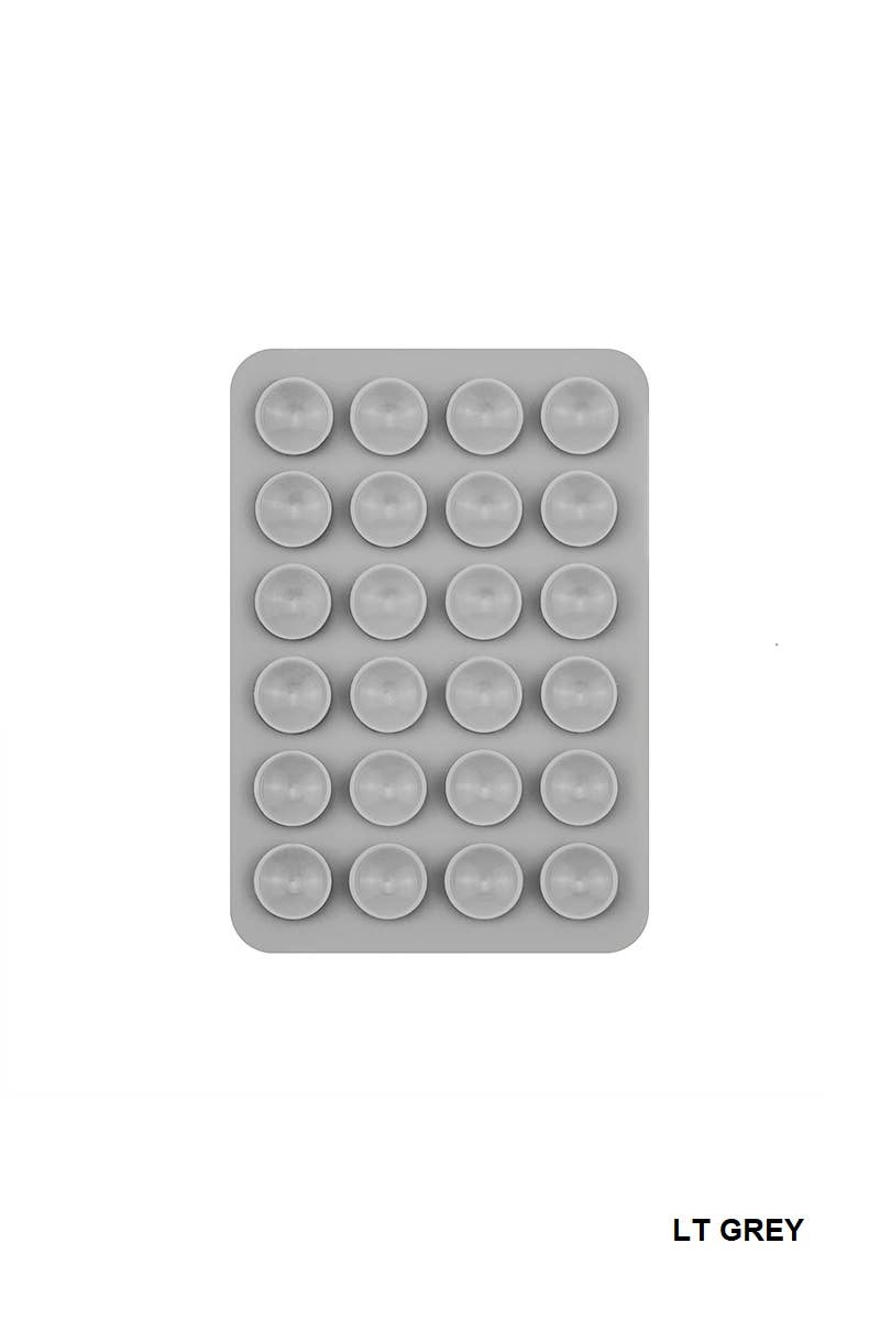 Rectangular silicone phone holder with multiple suction cups, designed for hands-free selfies and videos.