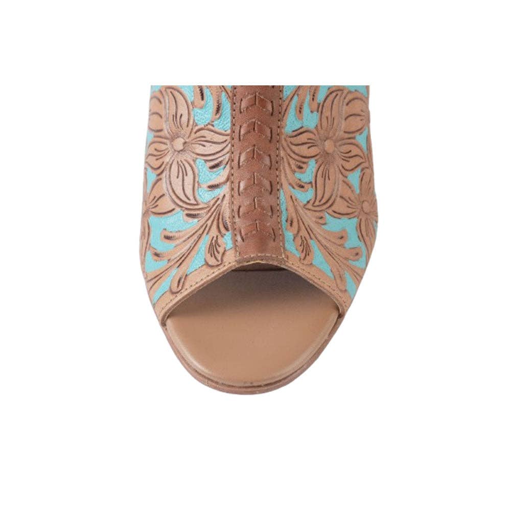 Floral-embossed tan and turquoise heel shoes with an open toe, chunky heel, and ankle strap for a secure fit.