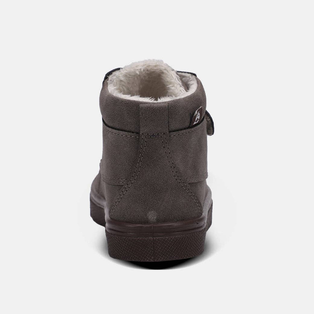 Soft upper boot with faux fur lining and double hook & loop strap for secure closure, featuring a cushioned footbed and durable outsole.