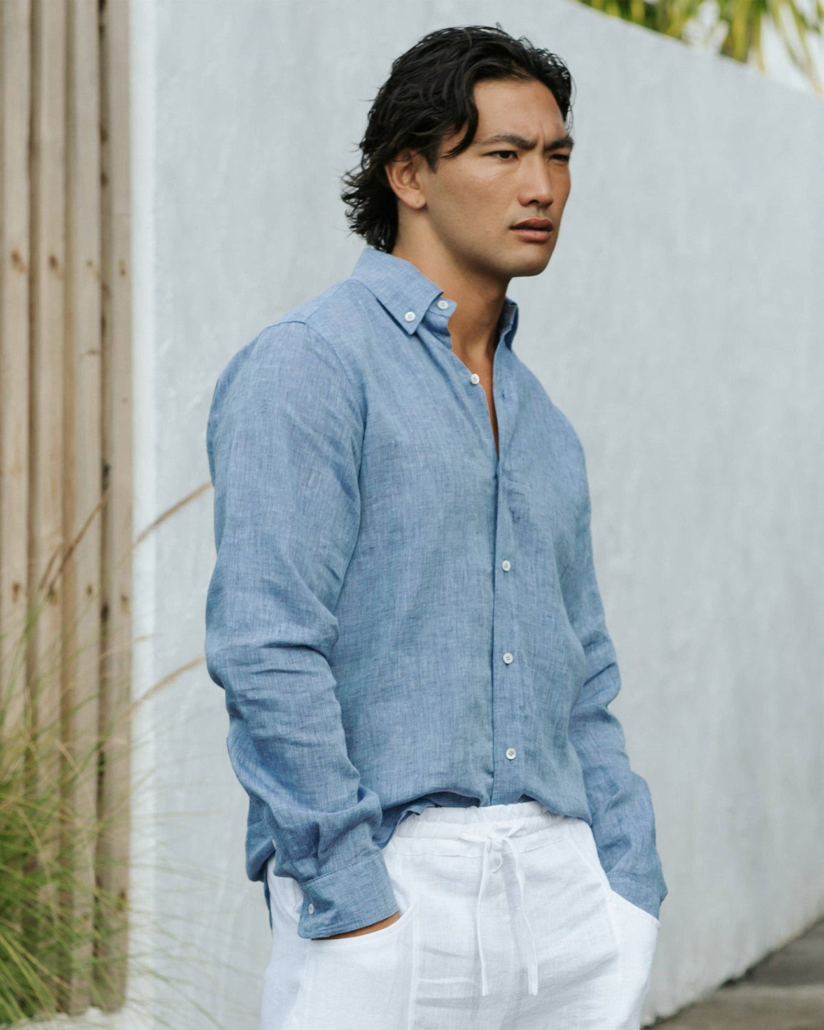 Long-sleeve button-up shirt in light denim chambray with a standard collar, perfect for casual styling.