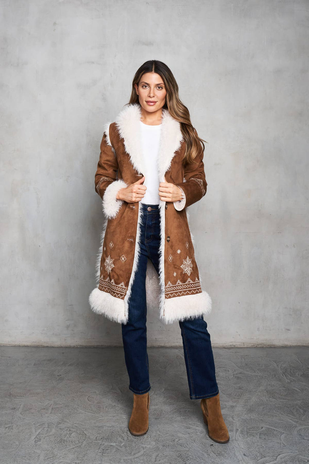 Faux suede camel coat with shearling trim and delicate embroidery on the front and back. Perfect for Western style.