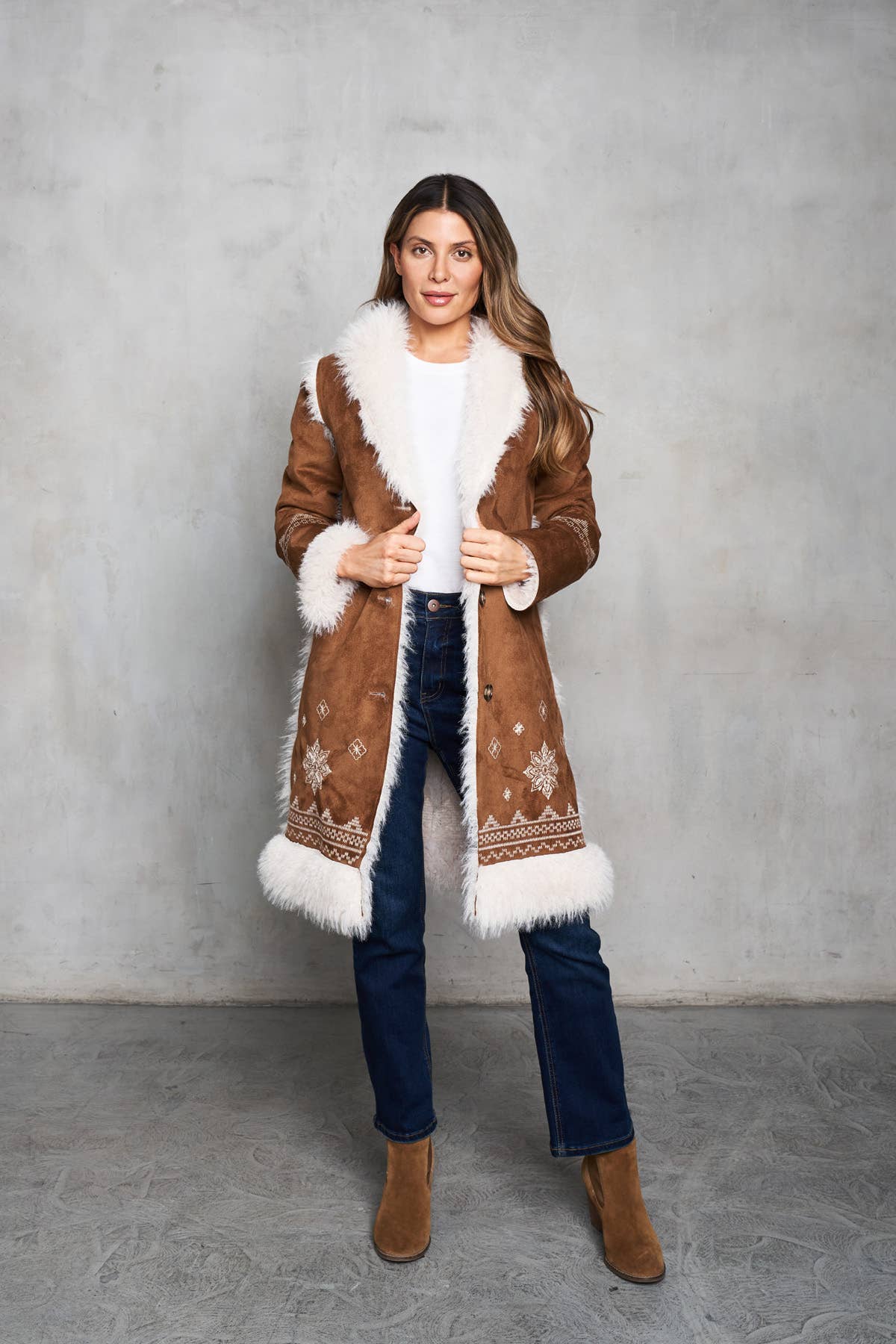 Faux suede camel coat with shearling trim and delicate embroidery on the front and back. Perfect for Western style.