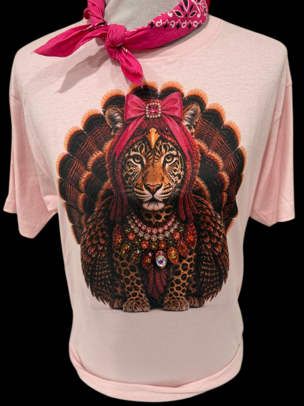 Light pink t-shirt featuring a jeweled collar turkey leopard graphic with embellishments and a pink bandana.