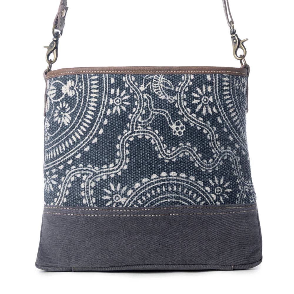 Navy kilim shoulder bag featuring a classic pattern, zip closure, and a comfortable shoulder strap.