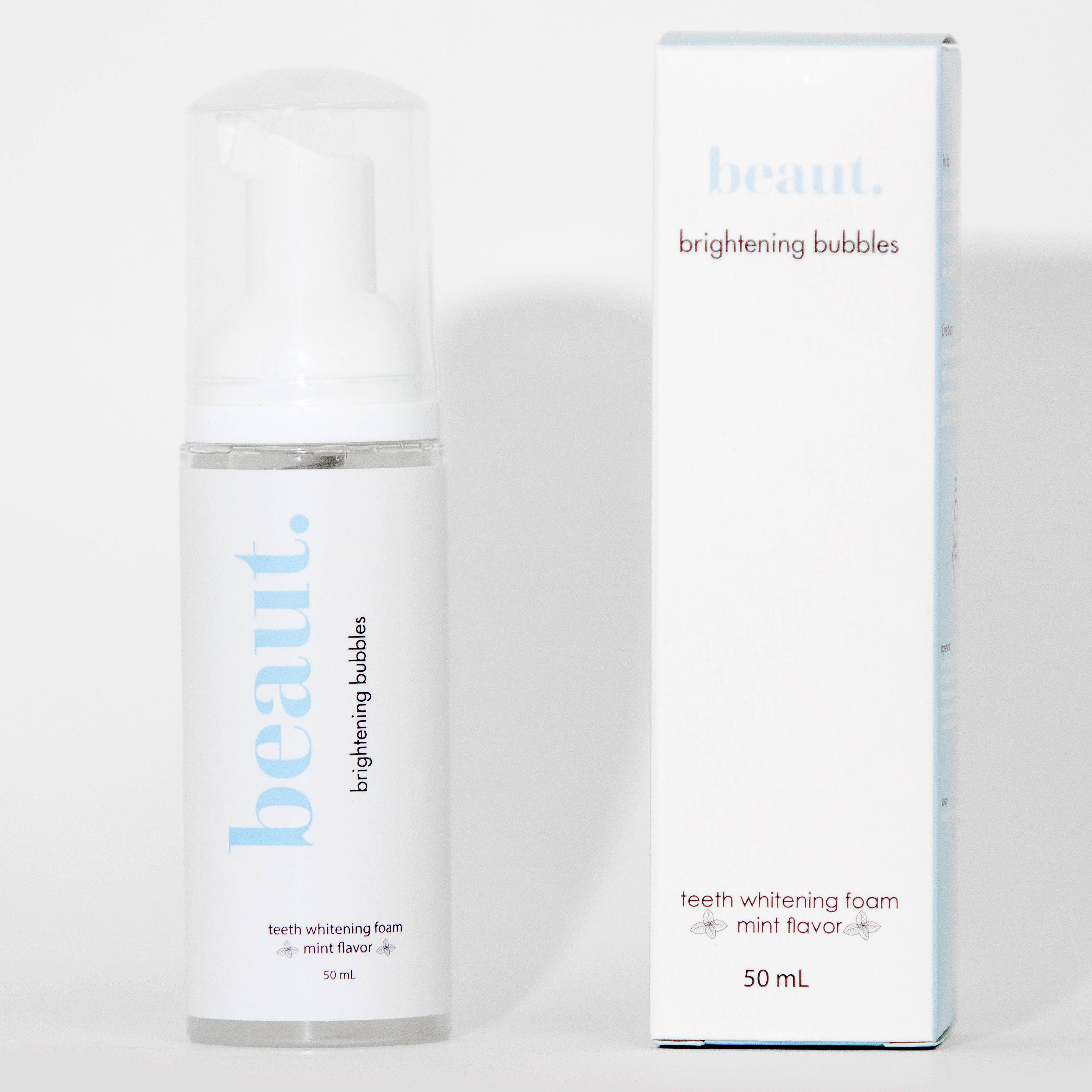 Clear pump bottle of Brightening Bubbles teeth whitening foam with a white cap and a label featuring mint flavor.
