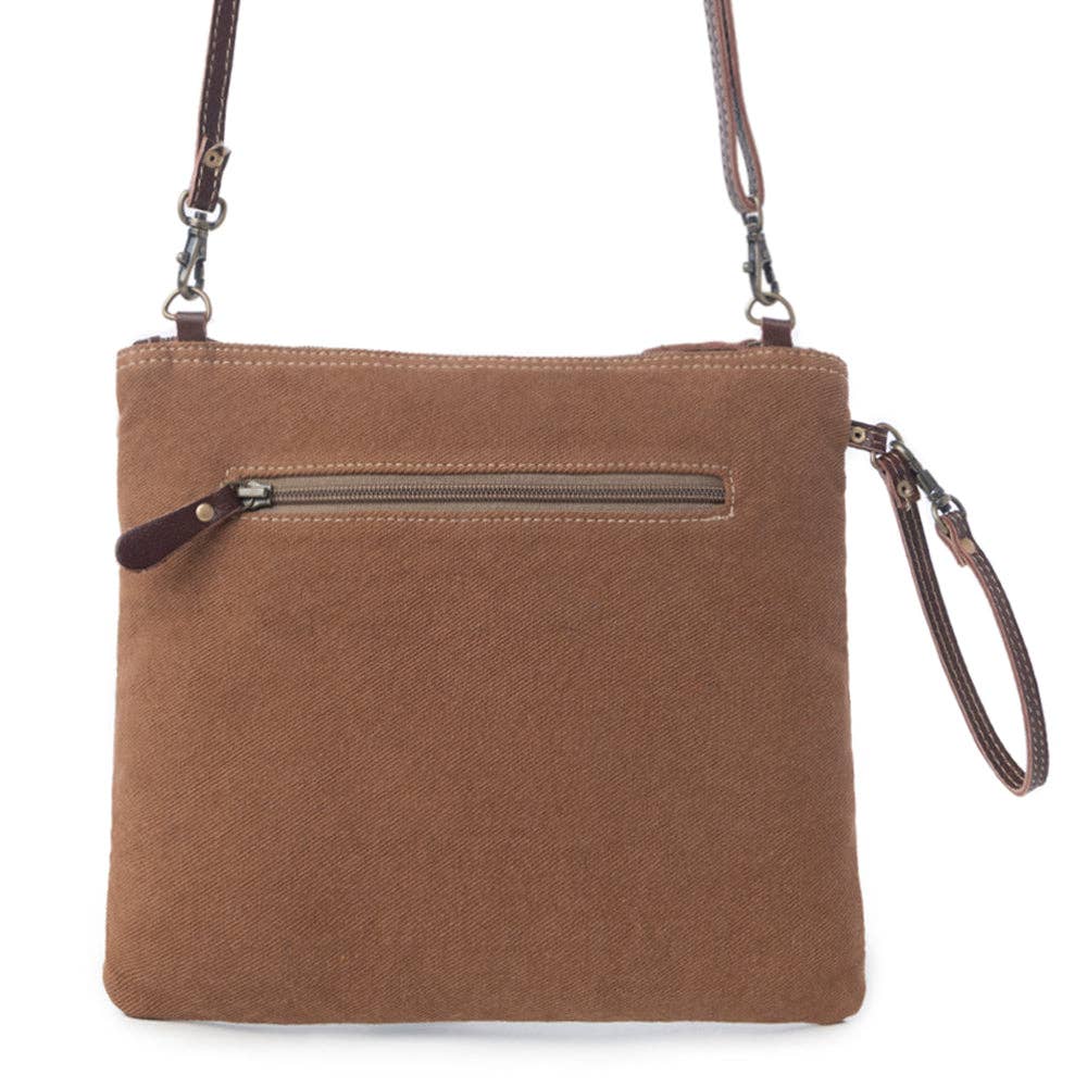 Brown canvas crossbody bag with a zippered pocket and turquoise embossed leather front design. Perfect for casual outings.