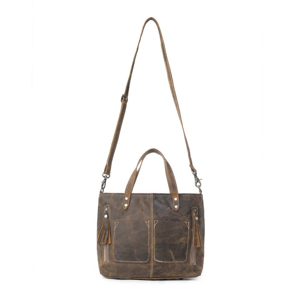 Fringed dark brown leather handbag with stylish zips, short handle, and long shoulder strap, featuring multiple compartments.