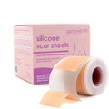 A roll of silicone scar sheets labeled for healing and lightening scars, partially unrolled to show its flexible design.