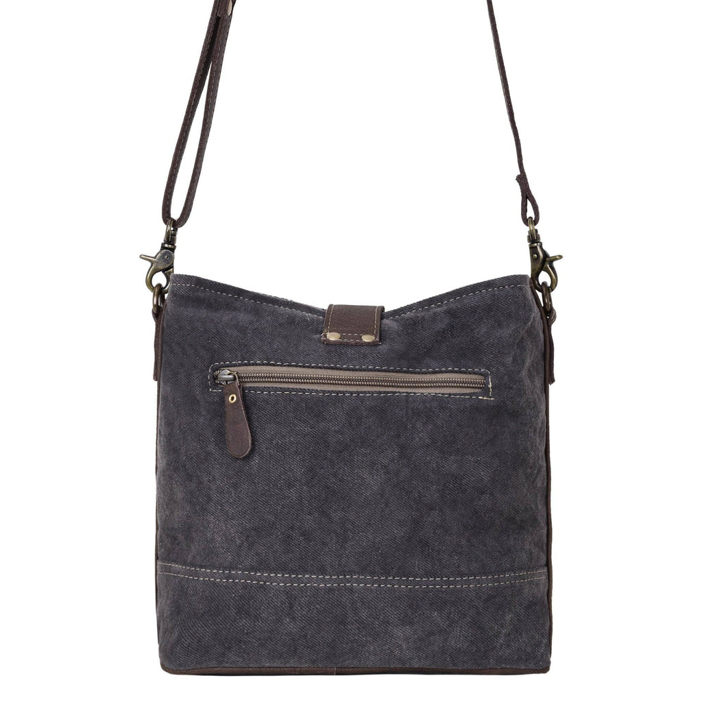 Debonair Shoulder Bag with adjustable strap and front zip pocket in a simple, solid design.