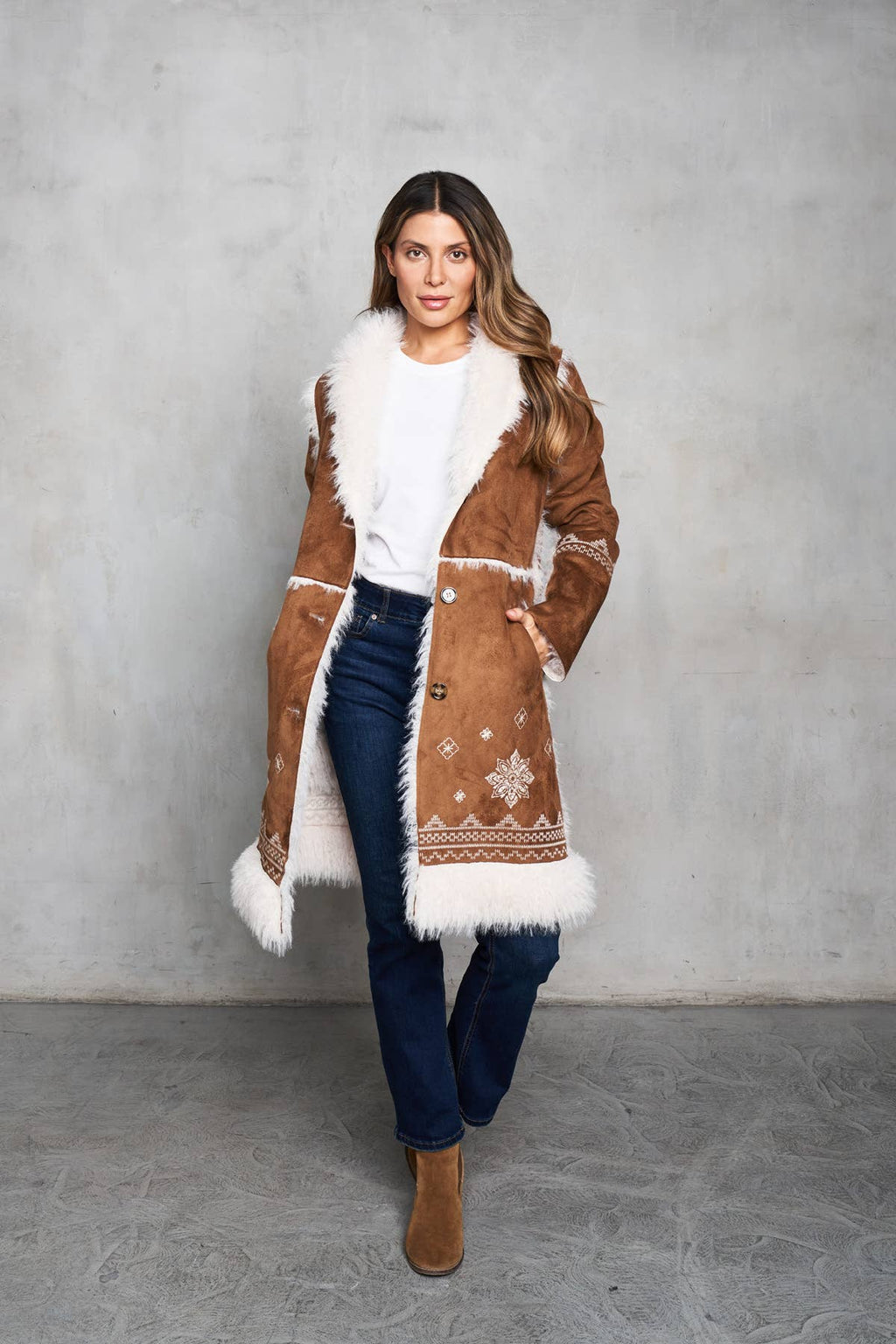 Faux suede camel coat with shearling trim, featuring delicate embroidery on the front, back, and sleeves.
