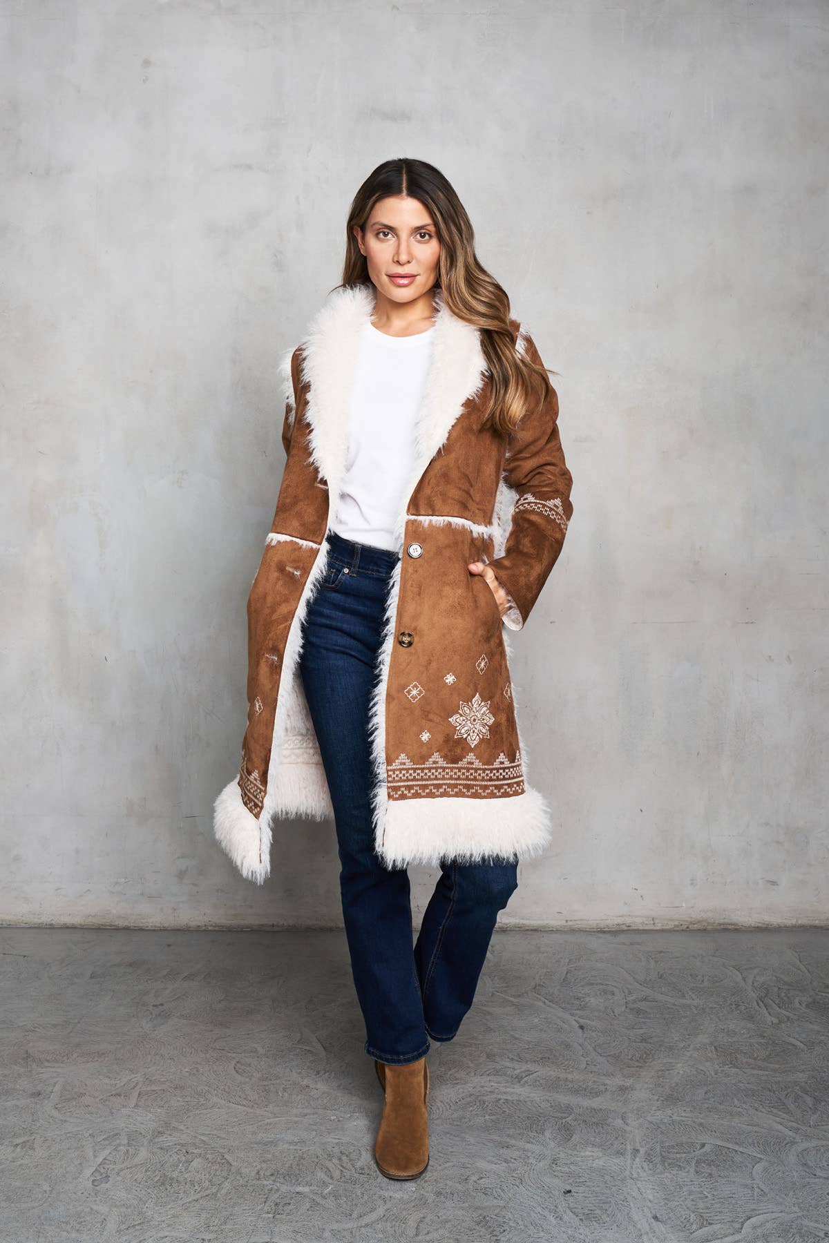Faux suede camel coat with shearling trim, featuring delicate embroidery on the front, back, and sleeves.
