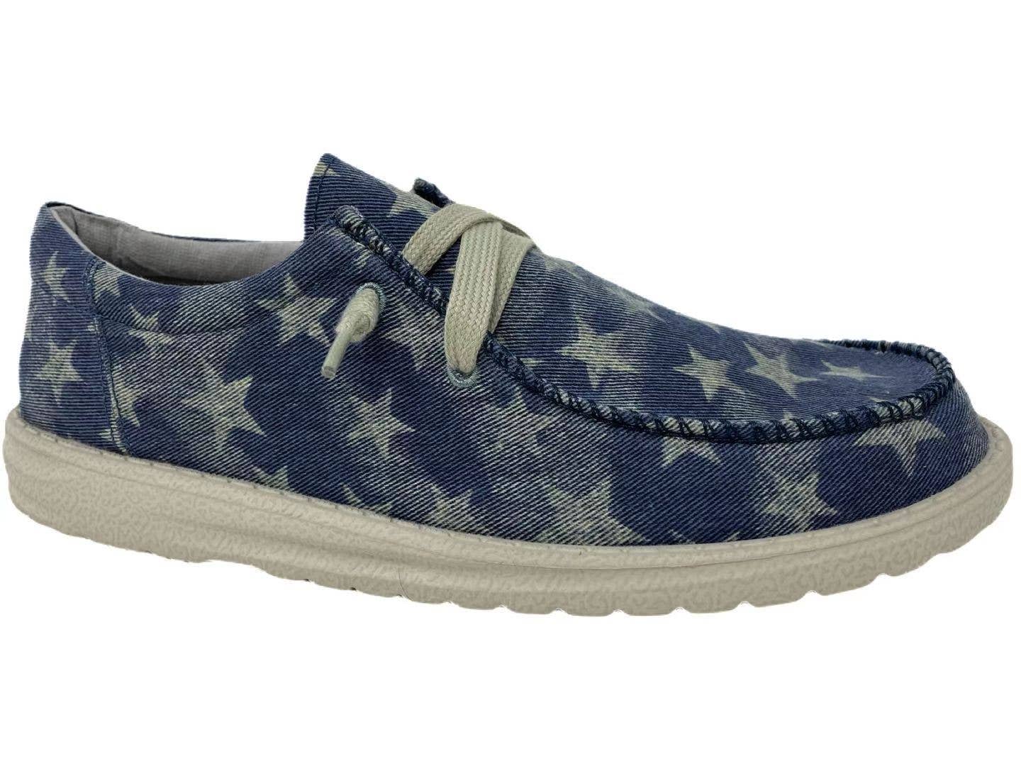 Slip-on shoe in blue with star patterns and a light-colored sole, perfect for casual wear and easy comfort.