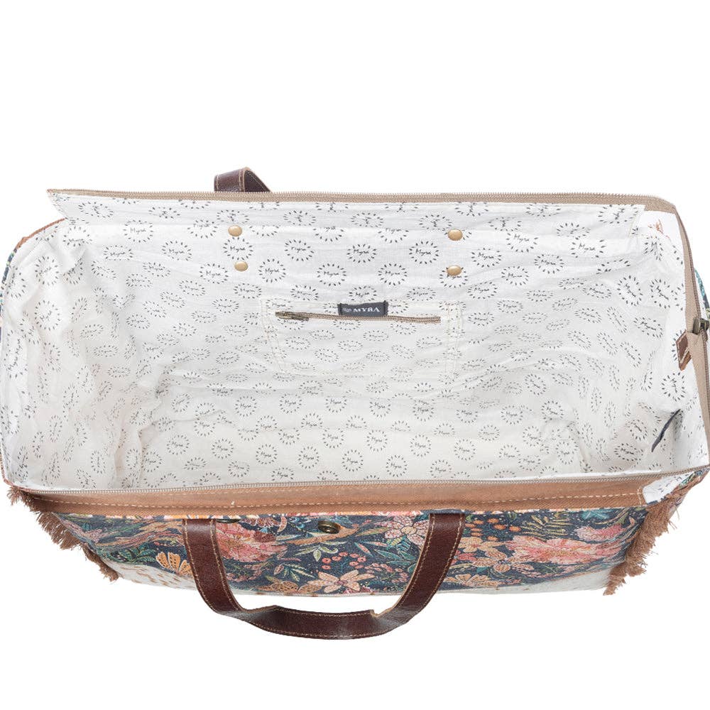 Floral interior lining and sturdy handles of the Fyole Weekender Bag, perfect for adventurous getaways.