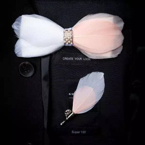 Handmade pink and white feather bow tie with a matching lapel pin, perfect for formal occasions.