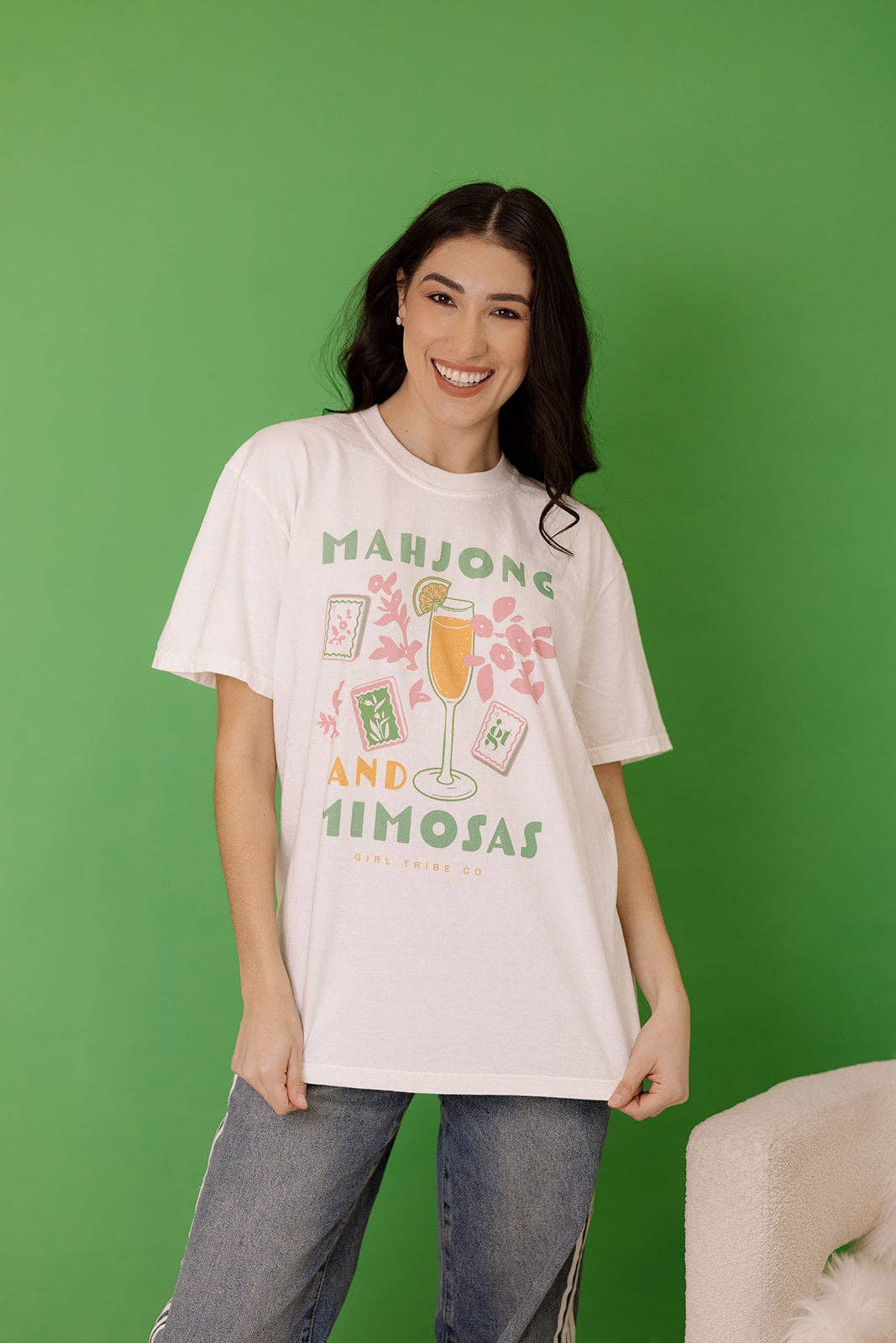 Light-colored Mahjong and Mimosas Tee featuring a graphic design with mahjong tiles and a cocktail, styled in a relaxed fit.