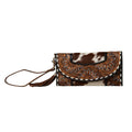 Hand-tooled floral wristlet wallet featuring a snap-close front flap and leather wristlet strap with a unique hair-on hide design.