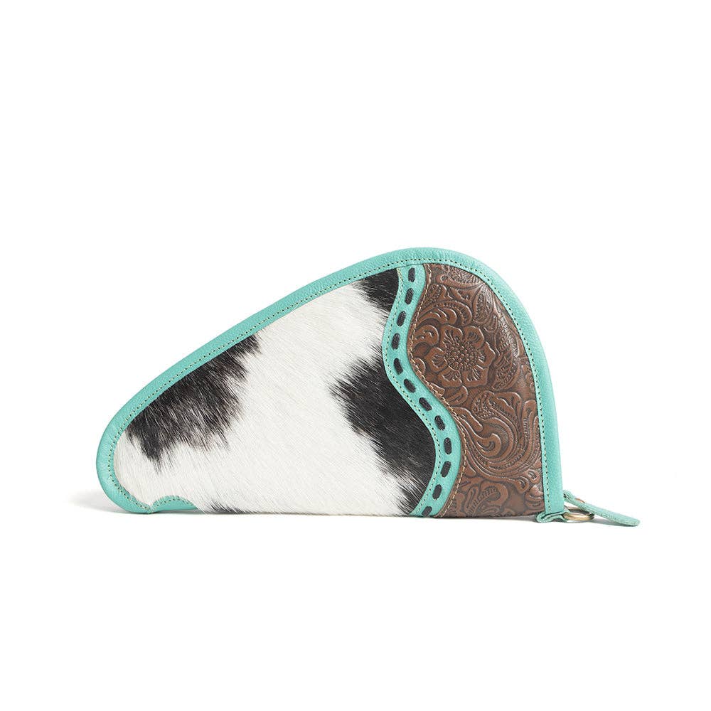 Turquoise-trimmed leather gun case with hand-tooled panel and black-and-white hairon, featuring a wrap-around zipper.