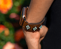 Leather band for Apple Watch featuring colorful beaded designs with a western flair. Perfect for daily wear.