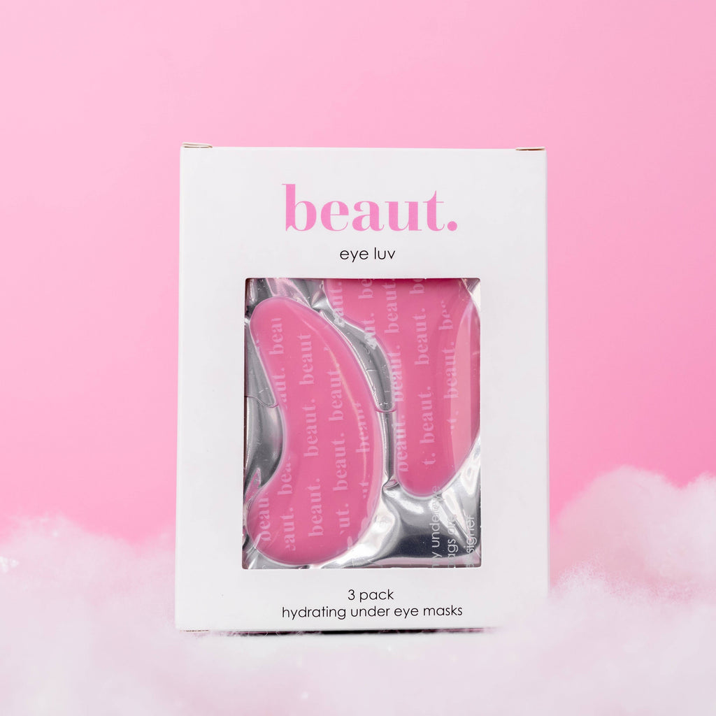 Three hydrating under-eye masks in a pink box labeled Eye Luv, designed to refresh and brighten the under-eye area.