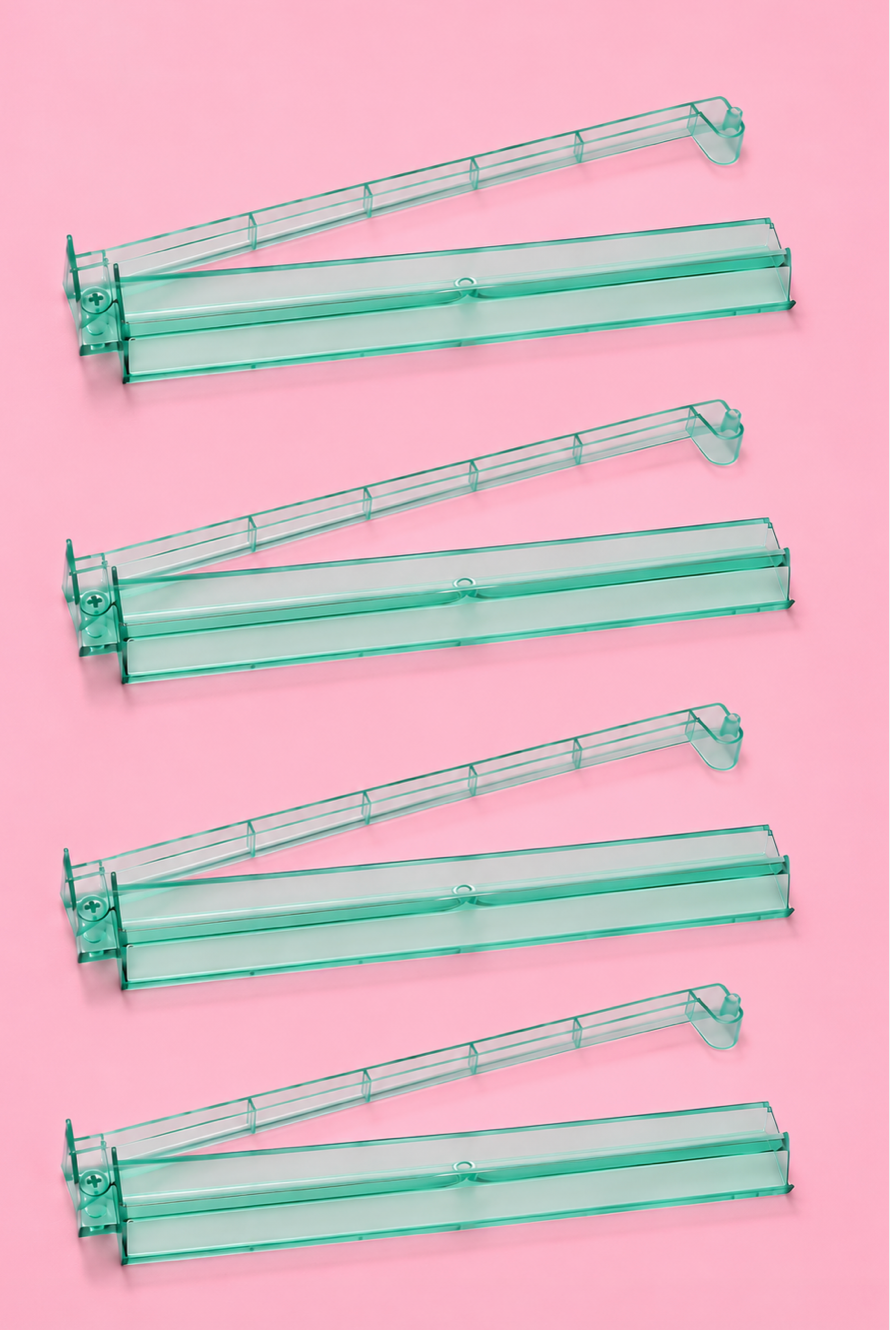 Set of four green acrylic Mahjong tile racks with pushers, designed for smooth and organized gameplay.