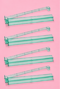 Set of four green acrylic Mahjong tile racks with pushers, designed for smooth and organized gameplay.