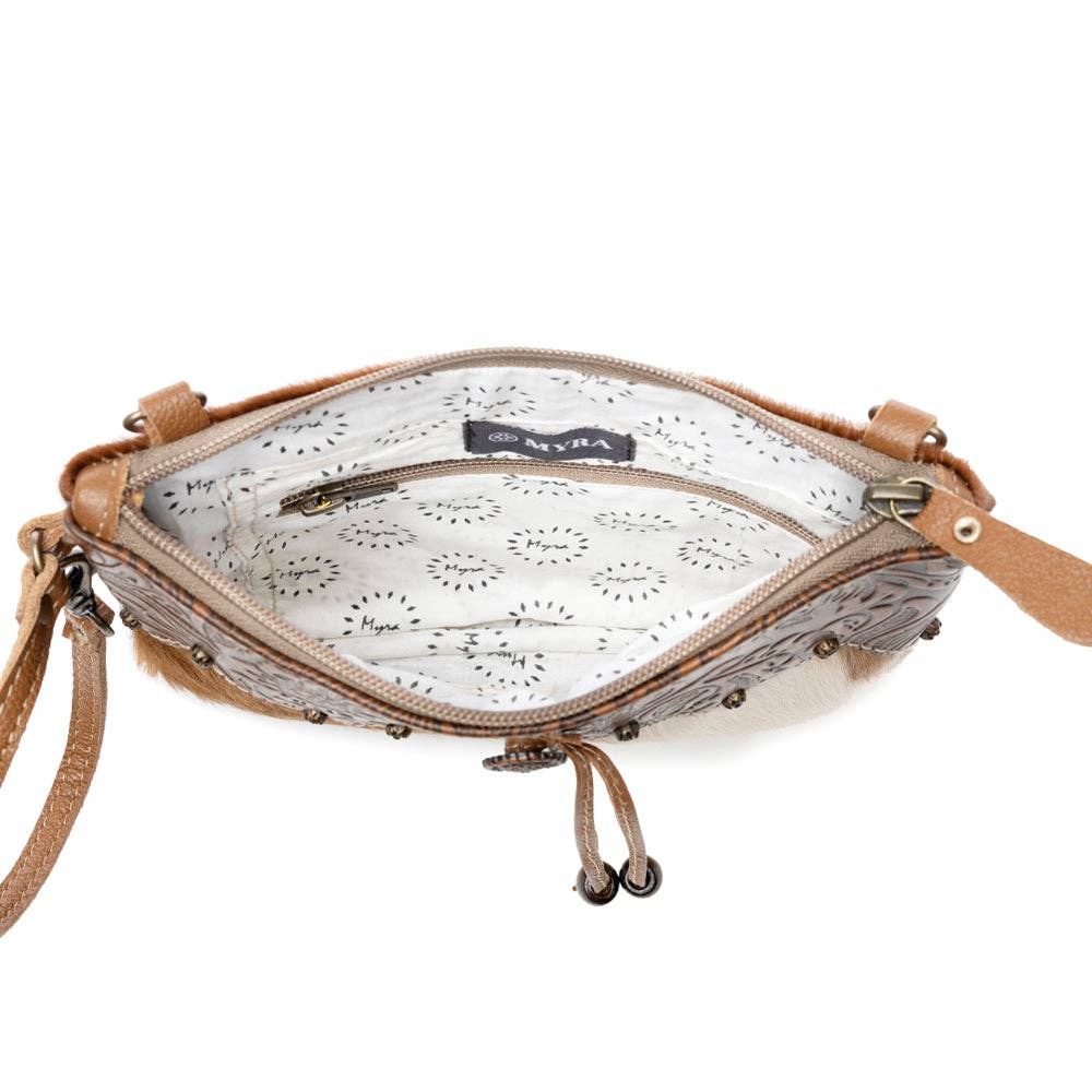 Brown leather handbag with hairon texture, featuring a strong back zipper and adjustable leather straps for comfort.