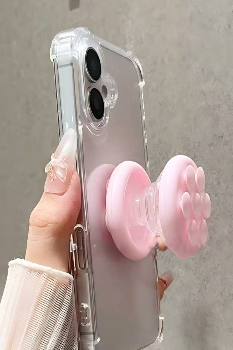 A pink Tik Tok Pop Socket suction cup phone grip with a textured surface, attached to a clear phone case.