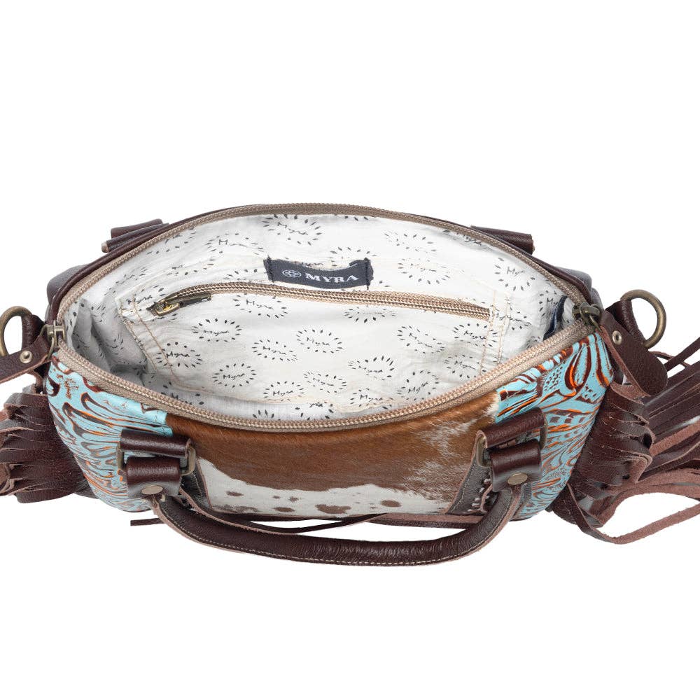 Spacious Maia Concealed Bag featuring fringe detailing and a broad handle for comfortable carrying.