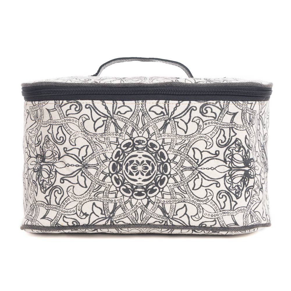 Vintage-inspired black and white toiletries bag with a woven texture and ebony leather handle. Perfect for travel or everyday use.