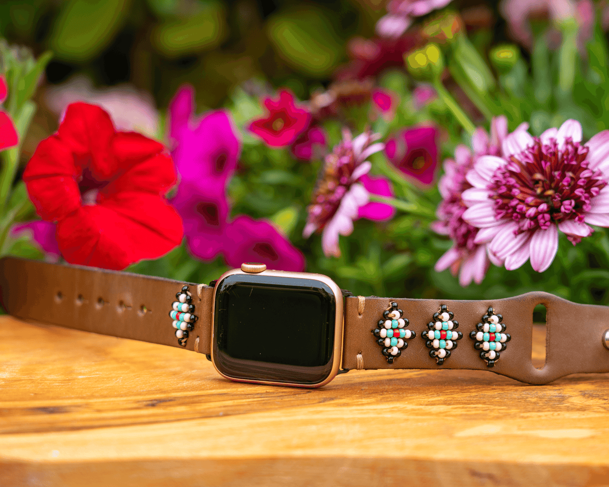 Beaded leather Apple Watch band featuring a colorful design inspired by Navajo and Aztec patterns.