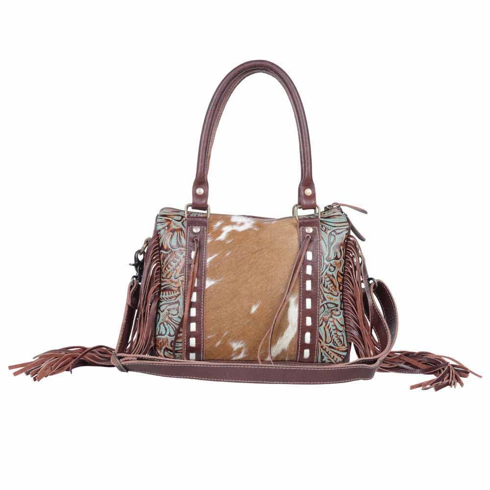 Fringe leather concealed carry bag featuring a broad handle and a spacious interior for everyday essentials.
