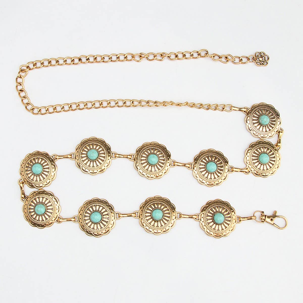 Turquoise decorative elements and floral motifs on a gold-toned vintage pattern chain belt. Perfect for a boho or cowgirl look.