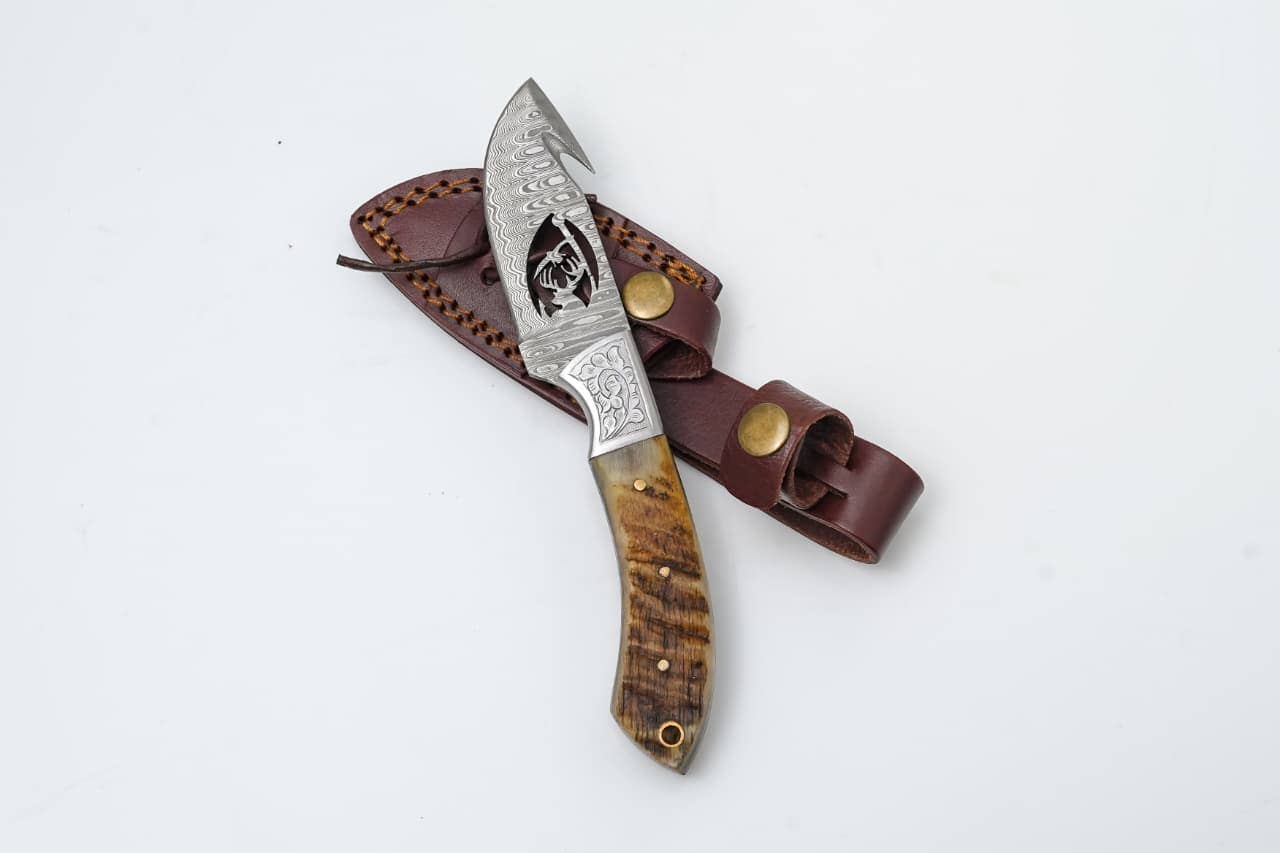 Titan International - Wire-Cut Damascus Guthook Knife with Ram Horn Handle