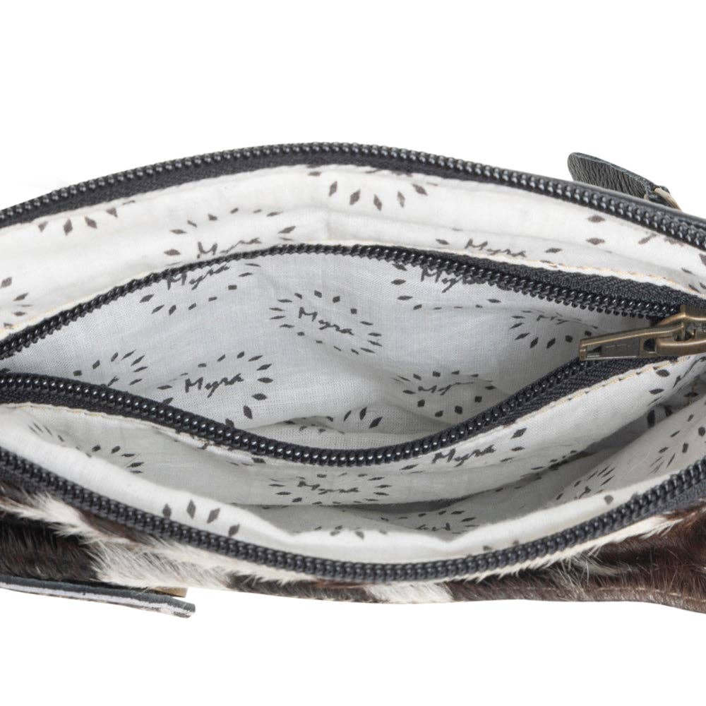 Light-colored interior lining with compartments in the Wild Chic Black & White Phone Case Bag, showcasing its functional design.