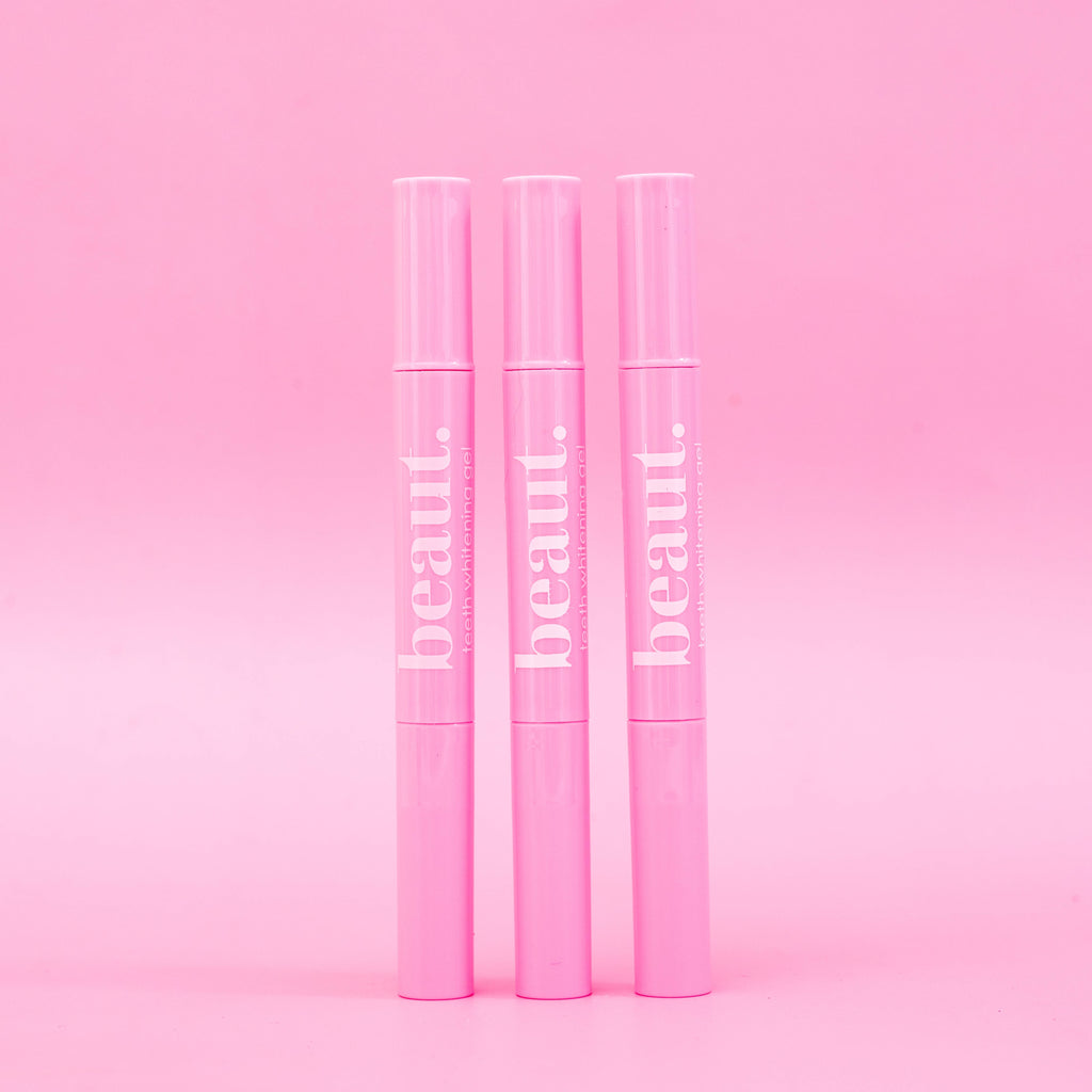 Three pink applicator pens labeled 'beaut.' arranged vertically, showcasing the vibrant color of the Polly Pink Kit.