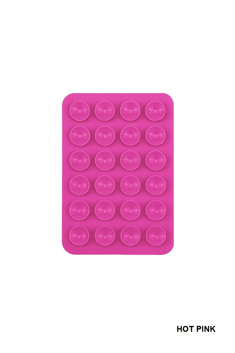 Hot pink silicone suction cup phone holder with multiple suction cups arranged in a grid pattern, perfect for hands-free use.