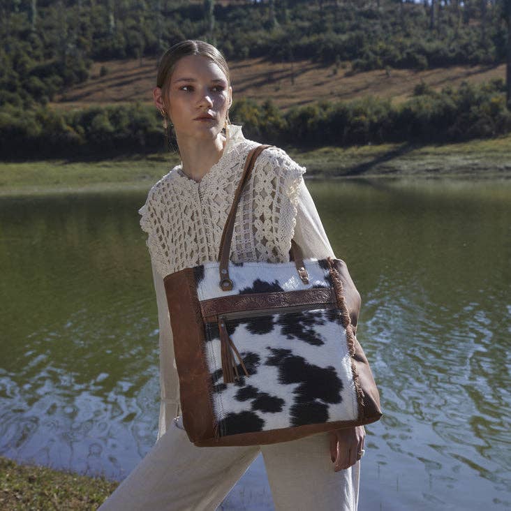 Large Oakley Specks Canvas & Hairon Bag featuring fringe details and an adjustable leather strap in neutral tones.