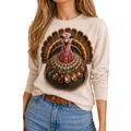 Long sleeve tee featuring a classic turkey graphic with a decorative collar of colorful stones on a natural background.