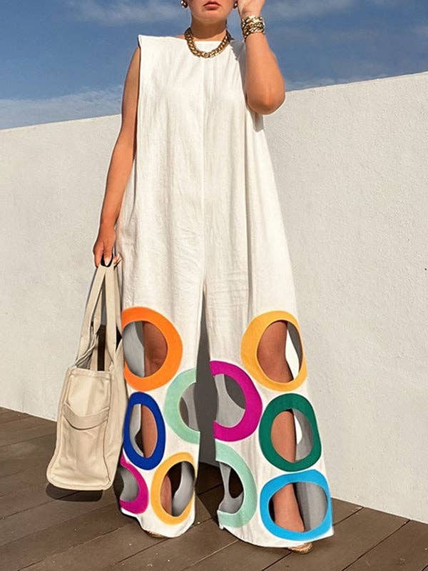 Loose sleeveless jumpsuit featuring a colorblock design with cutout sections and circular patterns at the bottom.