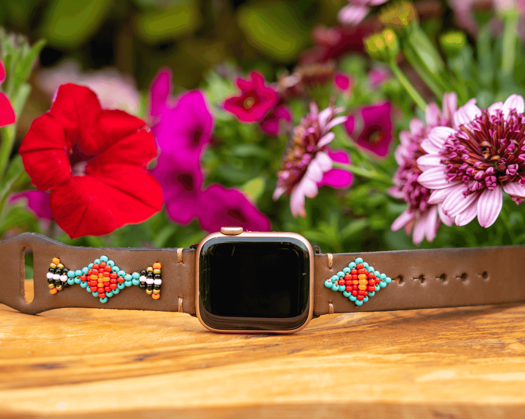 Beaded leather Apple Watch band featuring colorful patterns and multiple adjustment holes for a comfortable fit.
