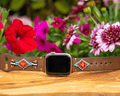 Beaded leather Apple Watch band featuring colorful patterns and multiple adjustment holes for a comfortable fit.