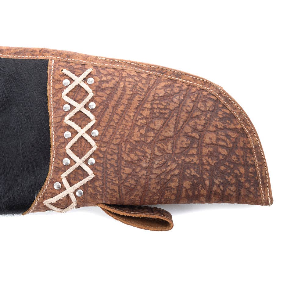 Black-and-white spotted hairon gun case with laced leather accents and dual top handles. Perfect for outdoor adventures.