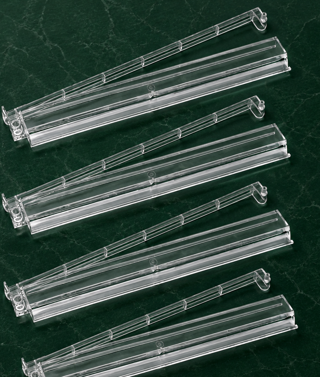 Clear Mahjong tile racks with pushers arranged in a row, designed for smooth gameplay and easy tile management.